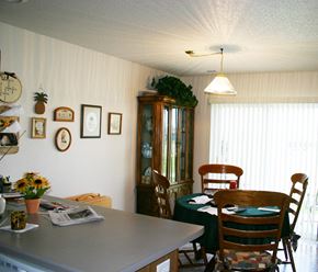 New Richland townhouse for rent - A dining room with a table set for four.