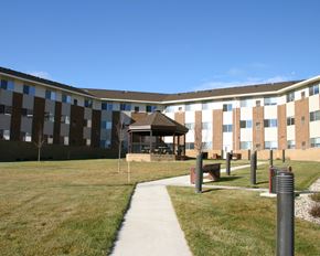 St. Peter apartment for rent - a building with a sidewalk and a gazebo in front of it