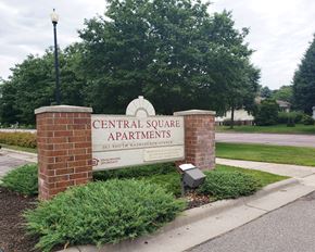 St. Peter apartment for rent - a sign for the central square apartments in front of a tree
