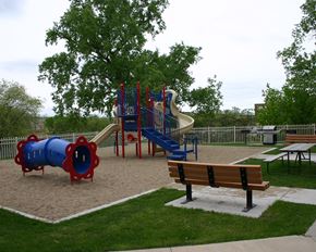 Mankato apartment for rent - a playground with slides and benches in a park