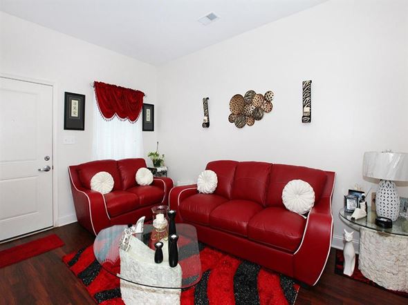 Philadelphia apartment for rent - a living room with two red couches and a glass table