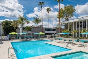Thousand Oaks apartment for rent - a swimming pool with chairs and umbrellas at a hotel