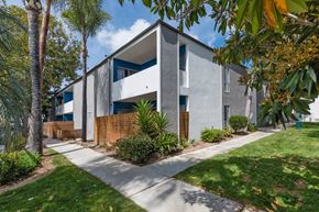 Thousand Oaks apartment for rent - the exterior of a building with trees and a sidewalk