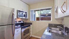 Thousand Oaks apartment for rent - a kitchen with stainless steel appliances and granite counter tops