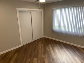 Los Angeles apartment for rent - a bedroom with wood floors and a window and a closet