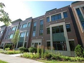 Chicago apartment for rent - a large brick building with a sidewalk in front of it