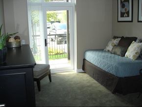Chicago apartment for rent - a bedroom with a bed and a door to a patio
