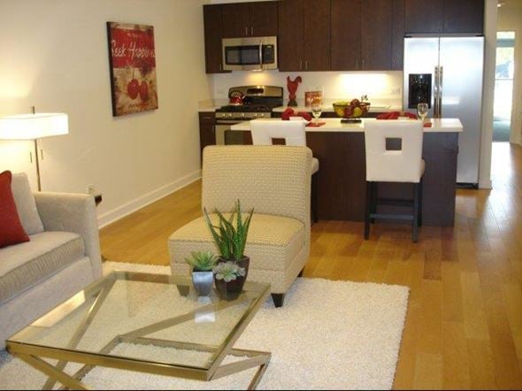 Chicago apartment for rent - a living room with a kitchen and a table