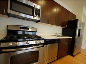 Chicago apartment for rent - a kitchen with stainless steel appliances and a microwave