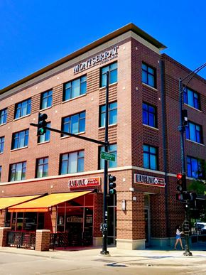 Chicago apartment for rent - a large brick building on the corner of a street