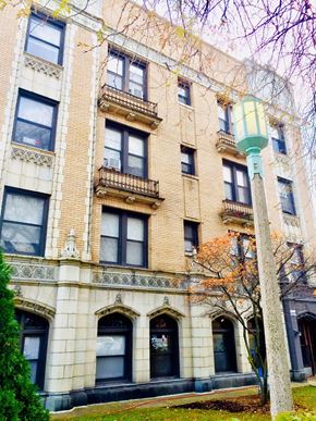 Chicago apartment for rent - a tall building with a street light in front of it
