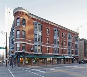 Chicago apartment for rent - a large brick building on the corner of a city street