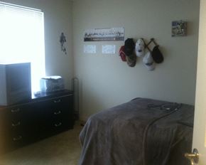 Faribault townhouse for rent - a bedroom with a bed and a dresser in it