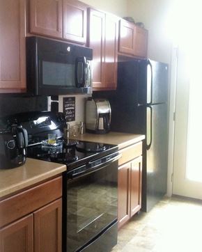 Faribault townhouse for rent - a kitchen with a stove and a refrigerator