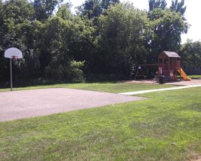 Jackson townhouse for rent - a playground with a swing set and a basketball court