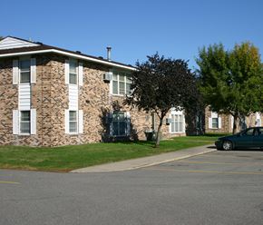 North Mankato apartment for rent - a large brick apartment building with a street in front of it