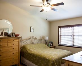 Northfield townhouse for rent - a bedroom with a bed and a ceiling fan