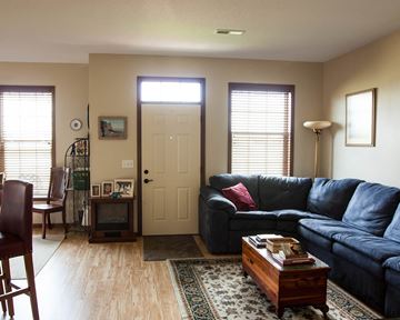 Northfield townhouse for rent - a living room with a blue couch and a coffee table