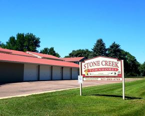 Luverne townhouse for rent - a stone creek townhomes sign in front of a building