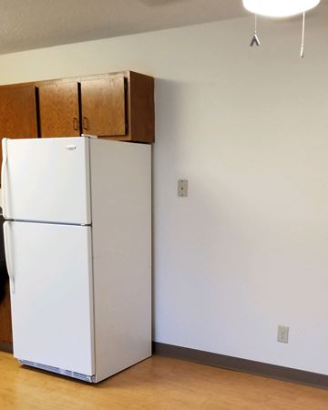 Silver Lake apartment for rent - a kitchen with a refrigerator and a cabinet on top of it