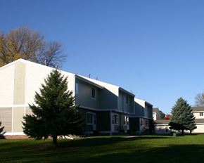 New Prague townhouse for rent - the side of a house with a yard in front of it