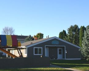 New Prague townhouse for rent - a house with a playground in front of it