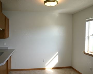 Worthington townhouse for rent - an empty kitchen with white walls and a light on the ceiling