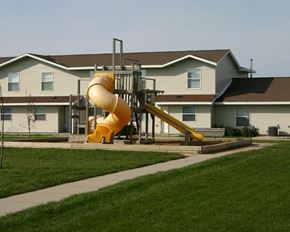 Worthington townhouse for rent - a large yellow spiraled slide in front of a house