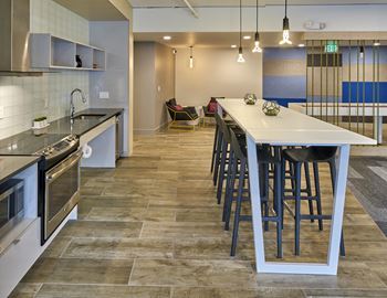 Resident lounge with full kitchen*, shuffleboard & foosball