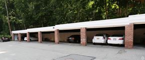 Roslyn apartment for rent - a car garage with three cars parked in it