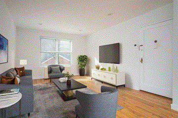 Roslyn apartment for rent - a living room with a couch and a table and a tv