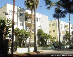 Los Angeles apartment for rent - an apartment building with palm trees in front of it