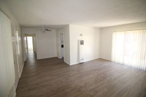 Los Angeles apartment for rent - an empty living room with wood floors and a ceiling fan
