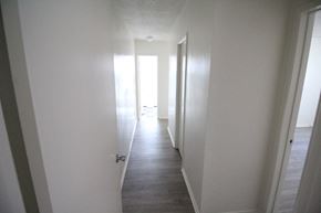 Los Angeles apartment for rent - a view down a hallway with white walls and white doors