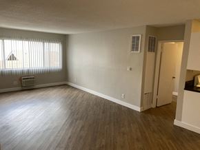 Los Angeles apartment for rent - an empty living room with wood floors and a window