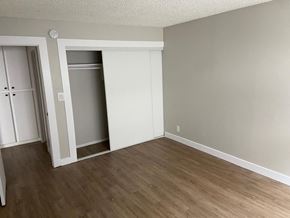 Los Angeles apartment for rent - an empty living room with wood floors and a closet