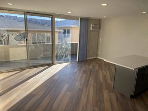 Los Angeles apartment for rent - a living room with wood floors and a large window