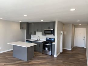 Los Angeles apartment for rent - a kitchen with gray cabinets and a white counter top
