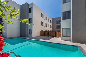 Los Angeles apartment for rent - a swimming pool in the backyard of an apartment building