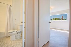 Los Angeles apartment for rent - a bathroom with a toilet and a white shower curtain