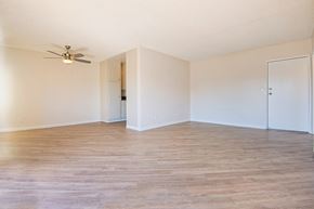 Los Angeles apartment for rent - an empty living room with wood floors and a ceiling fan