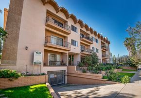 Los Angeles apartment for rent - an apartment building with balconies and a sidewalk