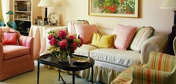 Argyle apartment for rent - a living room with a couch and a table with flowers