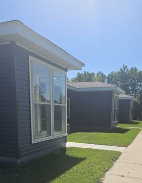 Clearbrook apartment for rent - A small house with a grey siding and a white window.