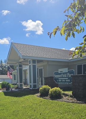 Clearbrook apartment for rent - A building with a sign that says "Summerfield Place" in front of it.