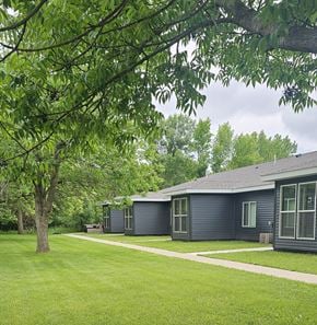 Erskine apartment for rent - A tree is in front of a house.