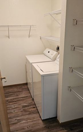 Fosston apartment for rent - A white cabinet with a white drawer and a white box on top of it.