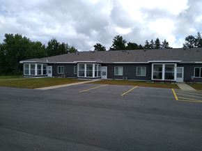 Park Rapids apartment for rent - a large building with a parking lot in front of it