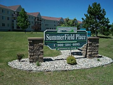 Park Rapids apartment for rent - the sign for summerfield place in front of an apartment building