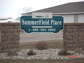Thief River Falls townhouse for rent - a sign for summerfield place in front of a house